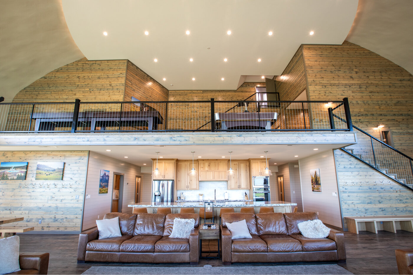 Teton View Retreat — West Cabin — great room interior looking up at the curved dome ceiling and second-floor balcony