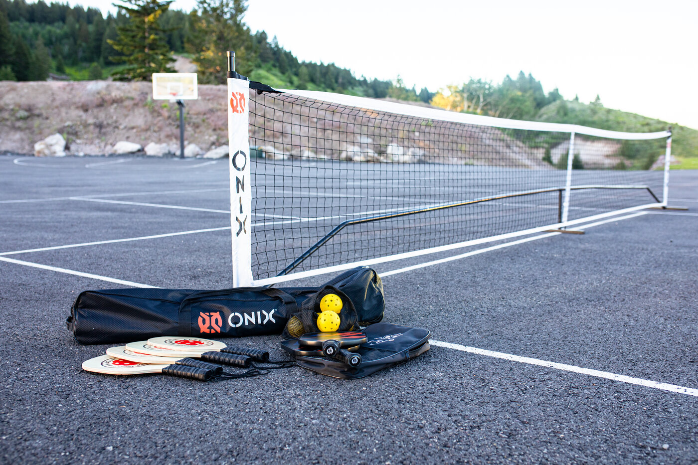 Teton View Retreat — West Cabin — pickleball net and Onix paddle set on the outdoor court
