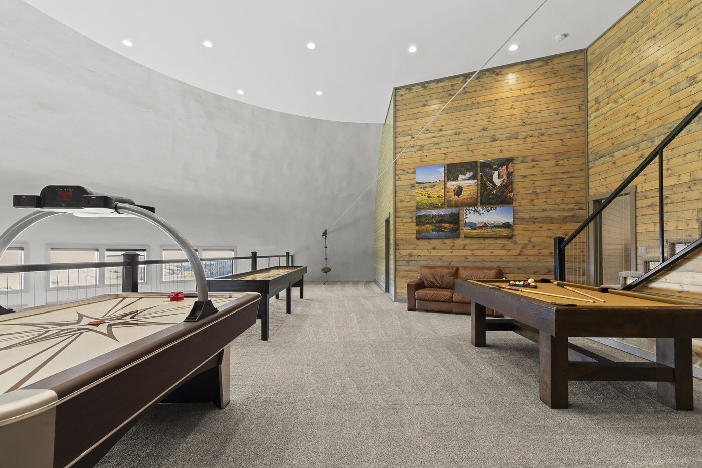 Teton View Retreat — West Cabin — game room with the curved dome wall, shuffleboard table, and pool table
