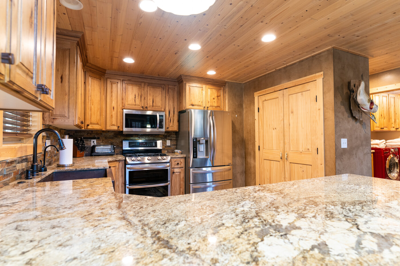 Trails End Lodge — kitchen granite counter detail with stainless appliances
