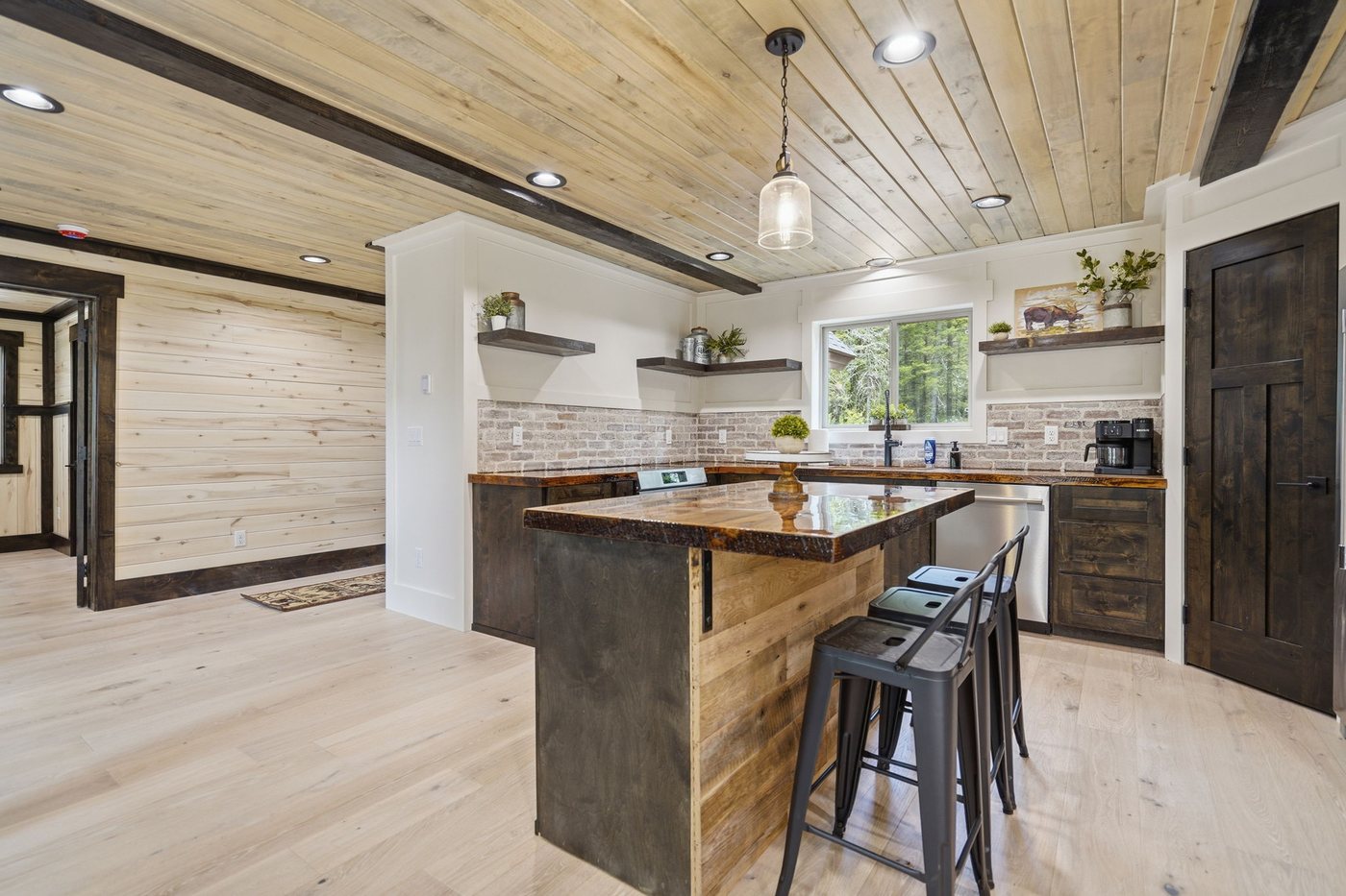 The Treehouse — kitchen island with butcher block counter and bar seating