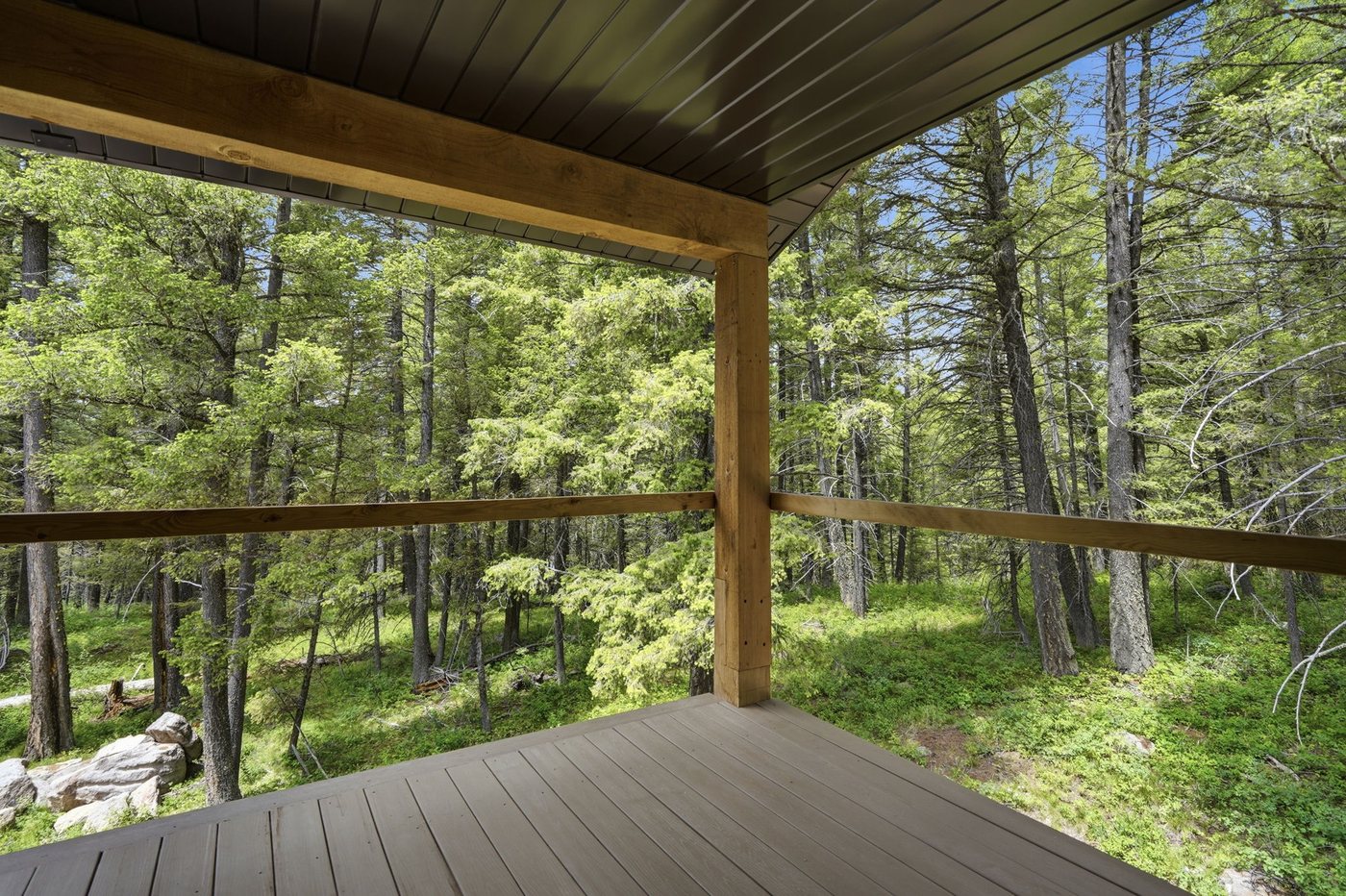 The Treehouse — second covered deck with pine forest views