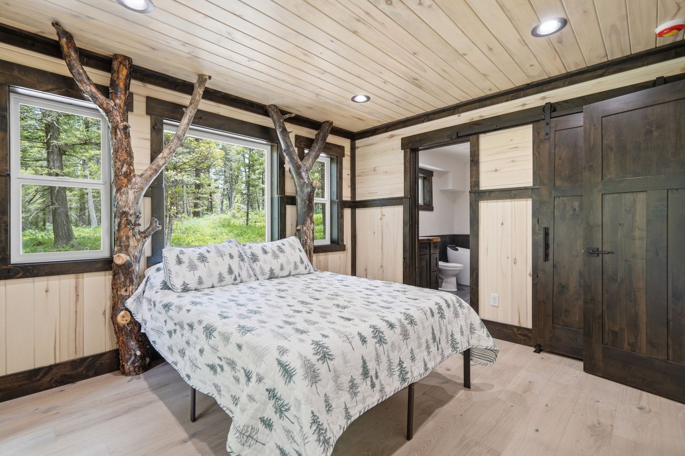 The Treehouse — master bedroom with branch canopy bed