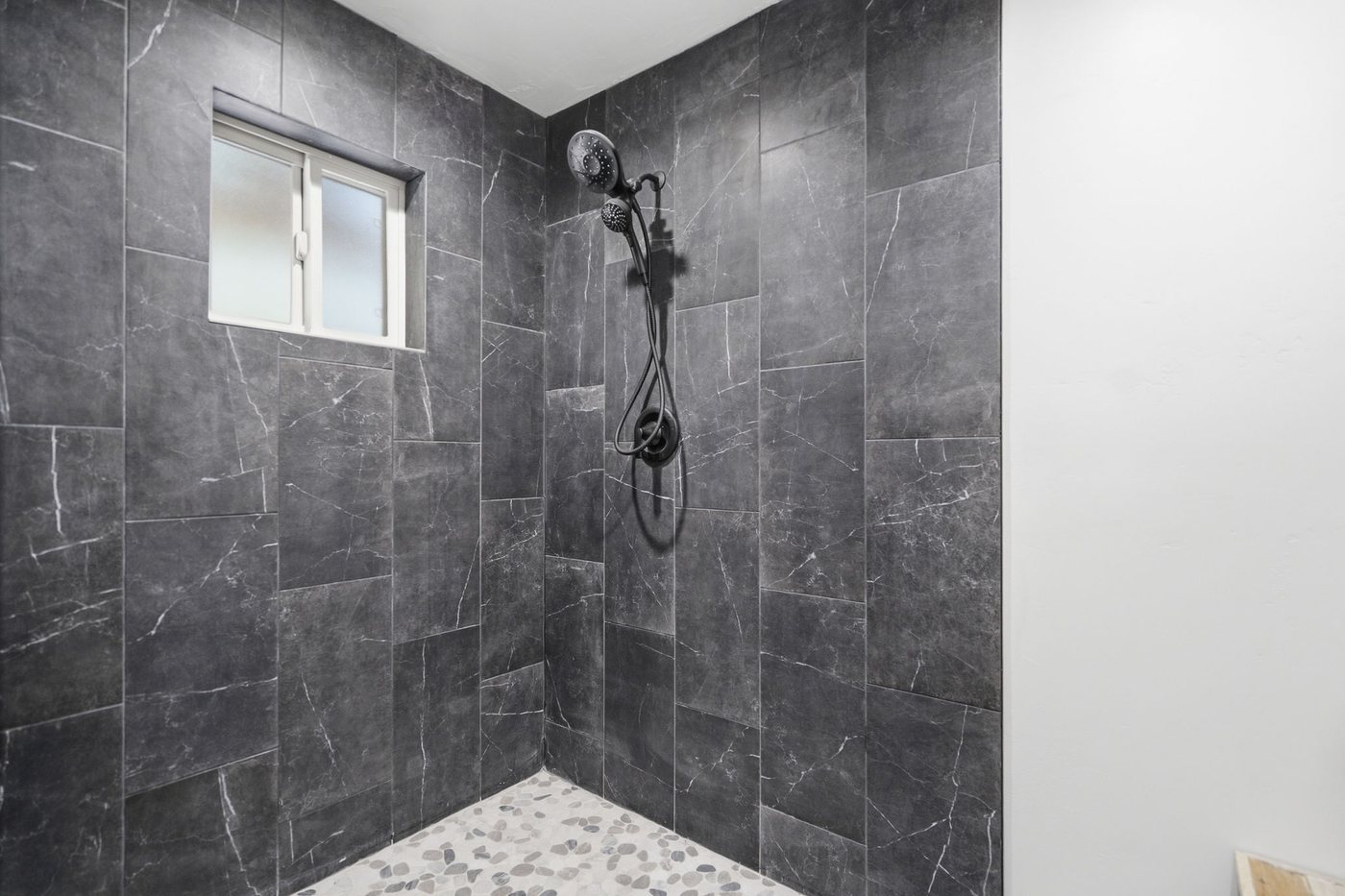 The Treehouse — slate walk-in waterfall shower