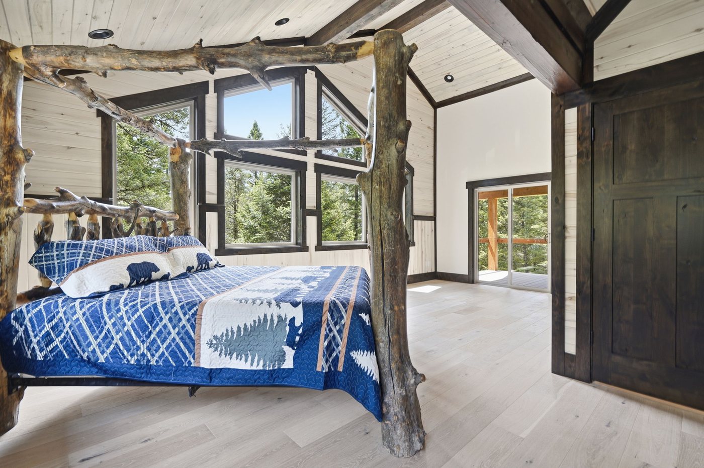 The Treehouse — guest bedroom with branch bed frame