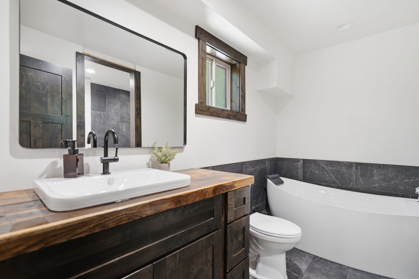 The Treehouse — bath with soaking tub and slate surround